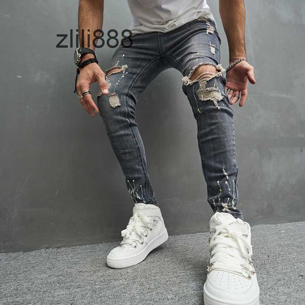 Jeans maschili jeans fashional casual sottili motociclisti in jeans pantaloni ginocchini hiphop strappato lavato in difficoltà