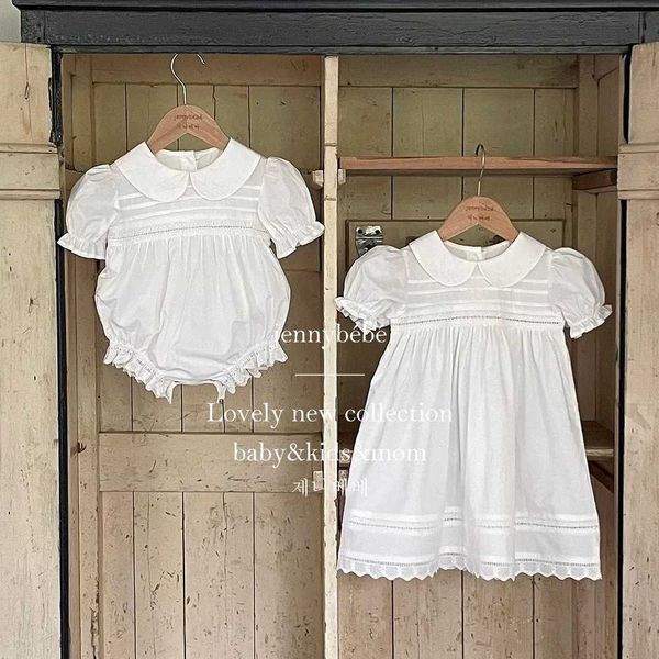 Rompers Bianco di ricamo in pizzo bianco BAMBINA PETALL FORNITORE ELEGANTE COMPRESSIONE COMPLEANNO COMPLEANNO 2024 SEMPIO SEMPIO SEMPIO SEMPI