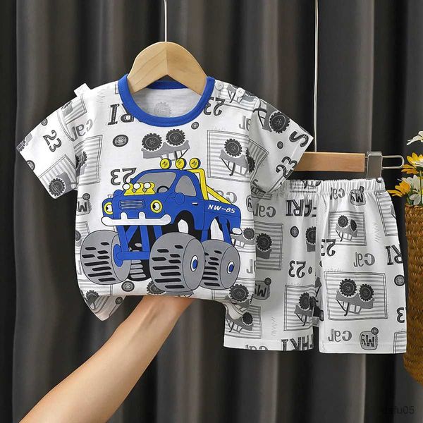 Roupas Conjuntos 2024 Novos garotos garotos pijamas de pm pijamas fofas de desenho animado de manga curta de manga curta com bermuda