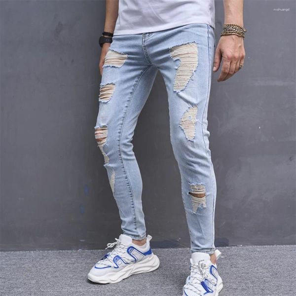 Jeans maschi maschi primaverili allungano buchi magri pantaloni strappati in difficoltà