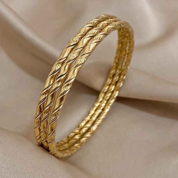 3pcs goldene Farbe Twist Edelstahl Armarmband Chic Classic Tibetan Buddha Armband Golden gestapelte Armreifen für Frauen 240428