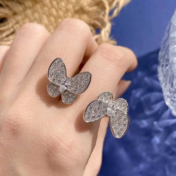 Anello unico per uomini e donne anello di farfalla alta fortunato a quattro foglie bianco pieno blu pieno con Cleefly comune