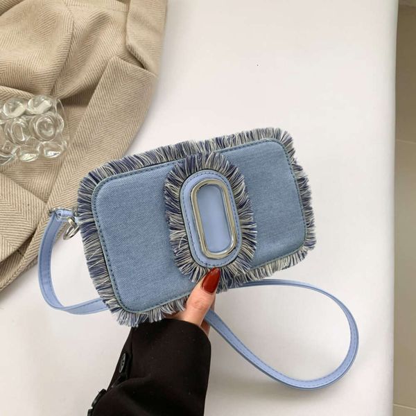 Novo jeans estilo menina picante para mulheres multidão borla bolsa crossbody de um ombro, popular na Internet, bolsa versátil para câmera 2024 78% de desconto no atacado da loja