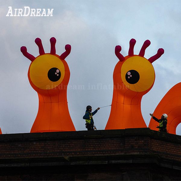 8mH (26ft) Mit Gebläse Großhandel 2024 Neuankömmling Orange Anpassbarer aufblasbarer Monster Single Eyes Modellballon LED-Leuchten Glow Pillars Replica