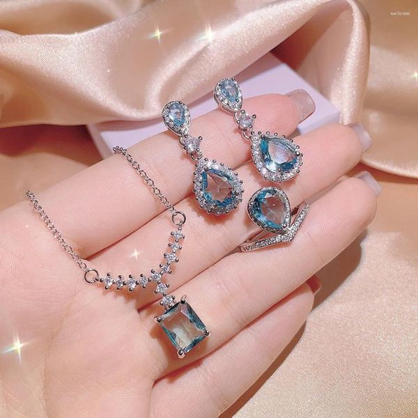 Set di orecchini di collana Set di anelli di orecchini a goccia per le donne Vedi gioielli con topazio blu creato Accessorio per feste di moda in colore argento