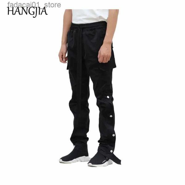 Jeans da uomo Pantaloni cargo neri Uomo Urban Hip Hop Streetwear Cinghie lunghe Jogging Bottoni oversize Pantaloni sportivi divisi Europeo americano Q240202