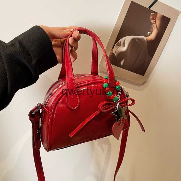 Bolsas de ombro Versão coreana nicho popular bolsa elegante bolsa de concha portátil bolsa feminina da moda 2024 nova primavera bolsa de ombro único bolsa crossbodyH2422