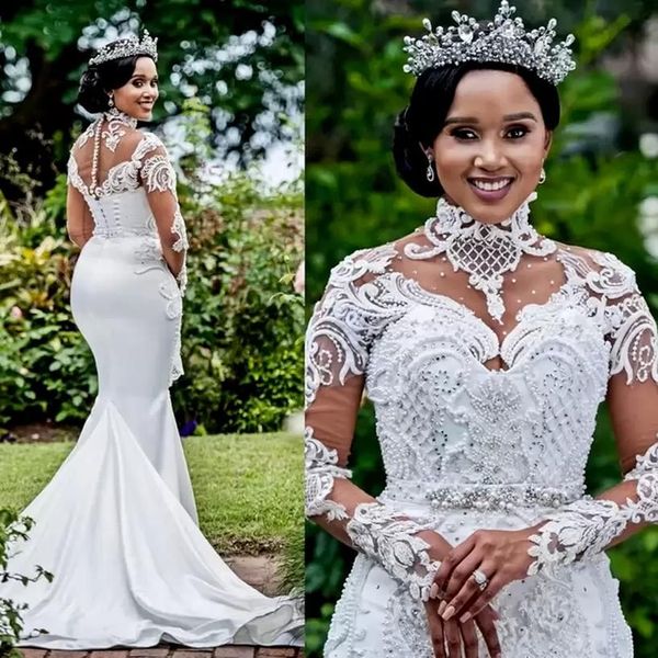 2024 Abiti da sposa a sirena con collo alto di lusso Abiti da sposa Sweep Train Pizzo Perle di cristallo Perline Plus Size Africano Nigeriano Fishtail Robe De Mariee Maniche lunghe