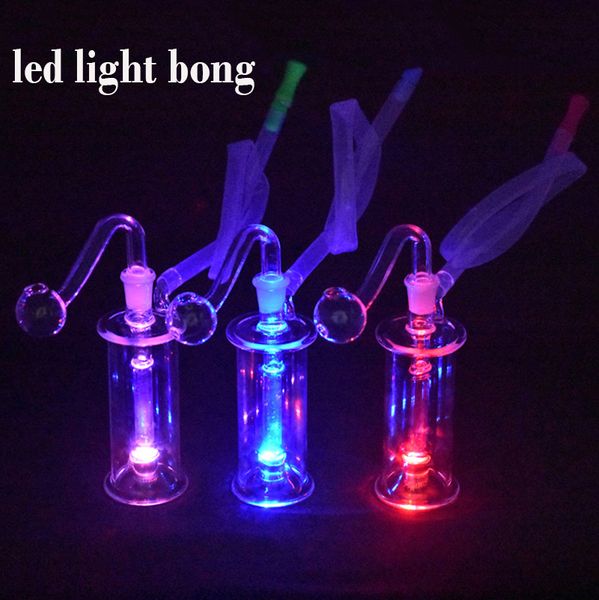 Atacado Glow In The Dark Glass Oil Burner Bongs LED Light Dab Rig Ash Catcher Bong Dab Oil Rigs com tubo de queimador de óleo de vidro de 10mm e mangueira mais barata