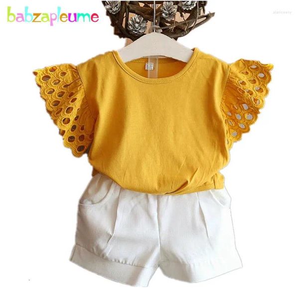 Set di abbigliamento 2024 Ragazze di estate Set Scava Fuori T-shirt Manica corta Top Pantaloncini 2 pezzi Vestito Vestiti del bambino Marchio coreano Costume A233