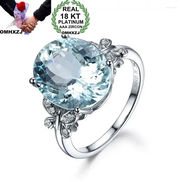 Anéis de Cluster OMHXZJ Atacado Moda Europeia Mulher Homem Festa de Casamento Presente Oval Branco Luz Azul Topázio AAA Zircão 18kt Anel de Ouro RR647