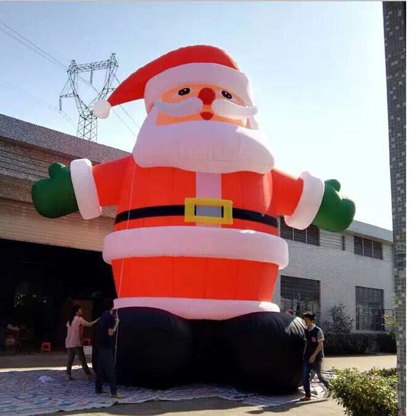 10 mH (33 piedi) all'ingrosso fantastico Babbo Natale gonfiabile gigante di Natale con guanti verdi Ventilatore con cinture nere per decorazioni esterne