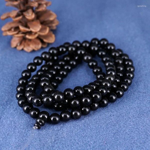 Bracciale rotondo in filo di corno nero con 108 perline