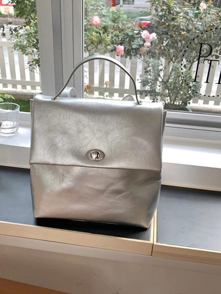 Borse da scuola 2024 Zaino di nicchia Ragazza Donna Semplice Avanzato Colore solido Argento Morbido Grande capacità Delicato Design unico Borsa da pendolare per donna