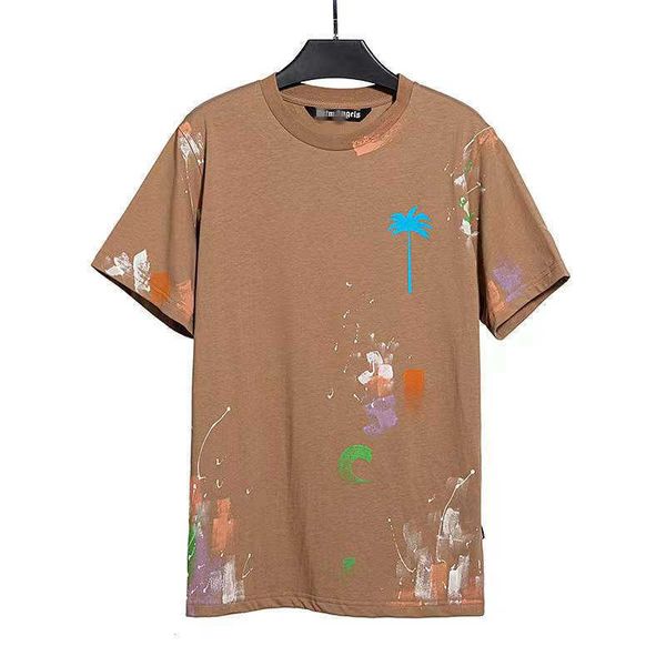 Chao Marca Palm Angel Color Splash Paint Coconut Print Camiseta de manga curta masculina e feminina High Street solta metade