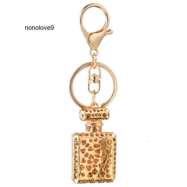 Design de moda chaveiro perfume garrafa chaveiros titular para mulheres criativo cristal strass diamante metal carro chaveiro saco pingente presente chaveiro