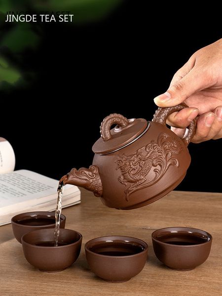 Xícaras de chá Yixing Conjuntos de argila roxa Handmade Dragão Bule com filtro Infusor de chá Coador Teacup Chaleira Household Teaware 230901