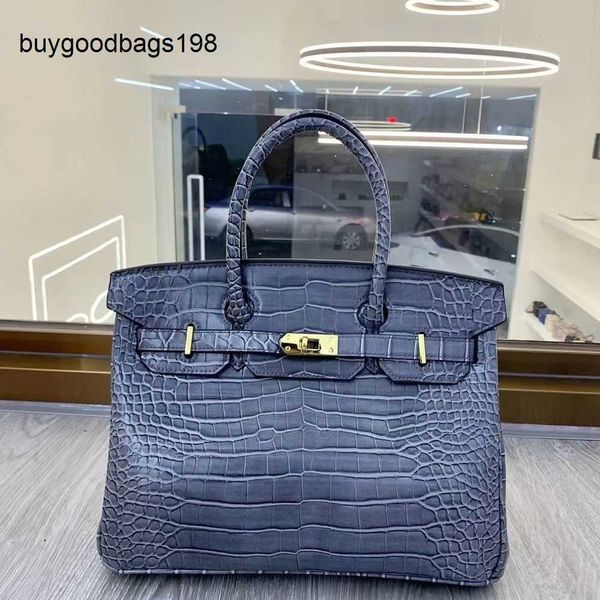 Handtasche handgefertigt 7A Yuan Bao Krokodilmuster Platin -Taschen Großhandel Womens Neue europäische und amerikanische Mode Kuhläden Große Pendler Vielseitig haben Logo haben Logo