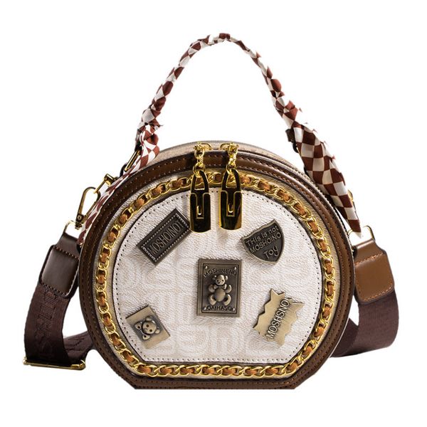 Bolsa de designer de luxo moda urso crachá bolo redondo saco versátil um ombro crossbody saco personalizado tendência pequeno saco redondo