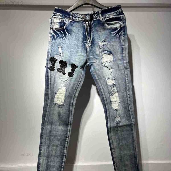 23nuovi jeans Amirss Jeans effetto consumato High Street Jeans con toppe rosse in rete da uomo e da donna