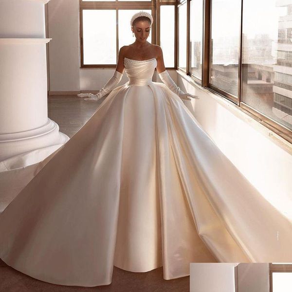 Ballkleidkleider Elegantes Ballkleidkleid 2023 Trägerlose Perlen Moderne Braut Sweep Zug Satin Arabisch Dubai Big Bow Vestido de Novia D Dh1Ei