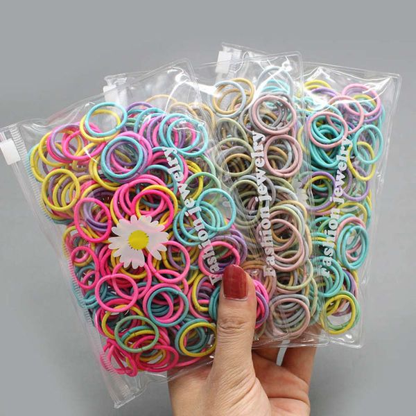 100 Pz/lotto Piccoli Legami Dei Capelli Gomma di Nylon Colorato Elastico Corda Accessori Per Capelli della Bambola Nero Fasce Elastiche Dei Capelli Per Le Neonate