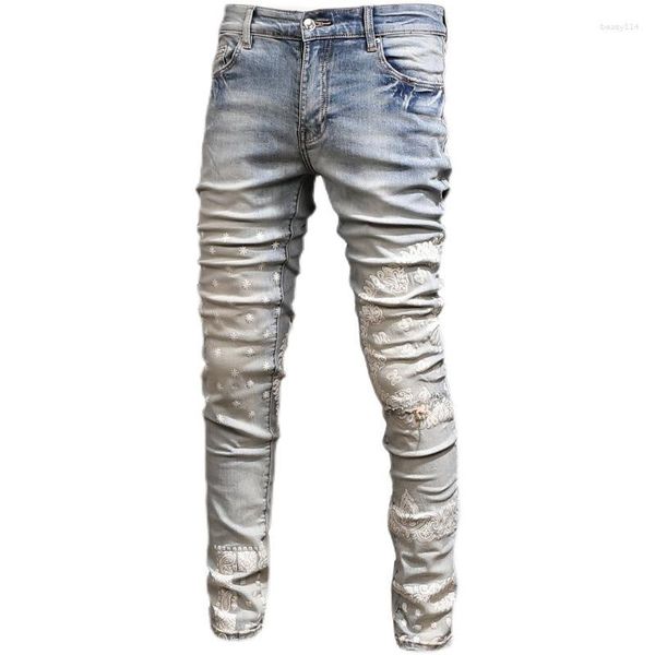 Jeans da uomo alla moda lavaggio retrò effetto anacardi stampa ricamo elasticizzato sottile matita di marca alla moda