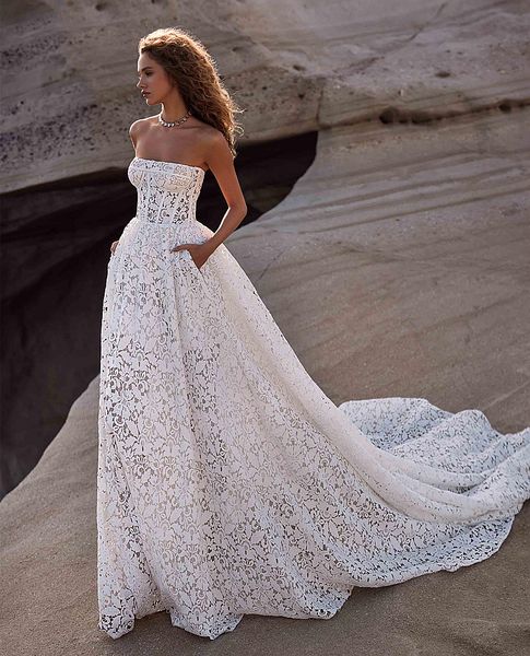 2023 Abiti da sposa country in pizzo pieno con tasche Corsetto senza spalline Una linea Abiti da sposa Sweetheart senza maniche Abito da sposa lungo Corte dei treni