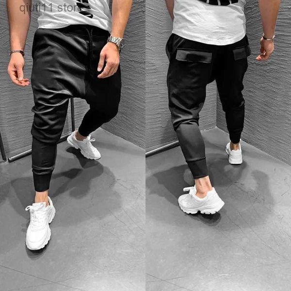 Pantaloni da uomo Abbigliamento uomo 2023 Pantaloni da jogging europei e americani multitasche da uomo Fitness Tempo libero Pantaloni sportivi da corsa elastici sottili T230928