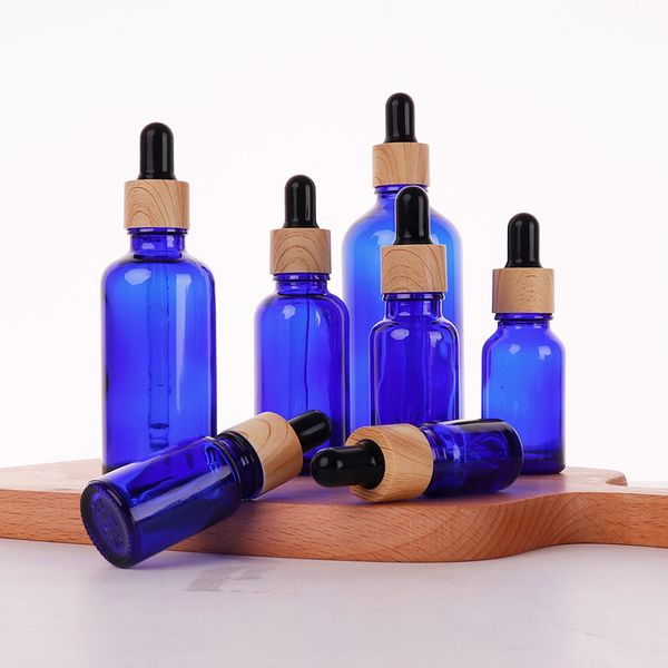 Bottiglie di profumo di siero di olio essenziale di vetro blu con contagocce Tappo di grano di legno per cosmetici liquidi 5 ml 10 ml 30 ml 50 ml 100 ml