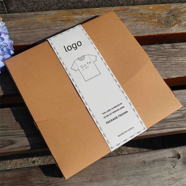 Maßgeschneiderte, biologisch abbaubare, faltbare Verpackungsbox aus Kraftpapier für T-Shirts und Kleidung mit Papierbändern. Gestalten Sie Ihr eigenes Logo A375