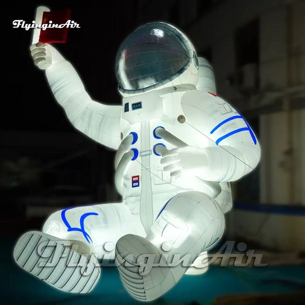 Riesiger aufblasbarer Astronauten-Modell-weißer Raumfahrer-Ballon, der Flagge mit LED-Licht für Parkdekoration hält
