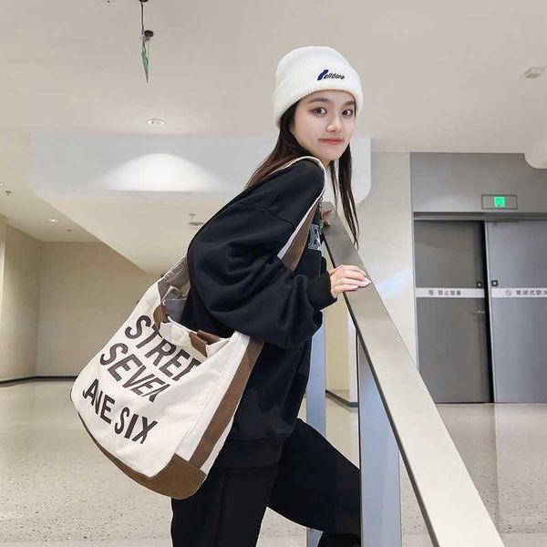Шоппинг палаты холст рюкзак женский студенческий студенческий мессенджер нейлоновый сумка для покупок новая буква широкая плечо.