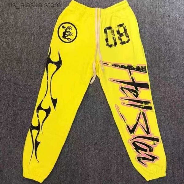 Pantaloni da uomo Giallo Pantaloni Hellstar American High Street Lettere Fiamma Stampa HELLSTAR Pantaloni sportivi di alta qualità Pantaloni corsetto Uomo Donna T230801