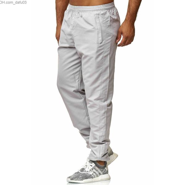 Мужские джинсы Новые весенние хлопковые бегуны мужчины качественные спортивные спортивные штаны Мужские беговые спортивные брюки.