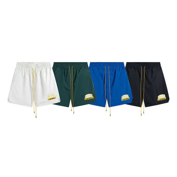 Rhude American Street Fashion Shorts esportivos de cor sólida com emblema bordado Calças de praia masculinas e femininas Casal trimestre