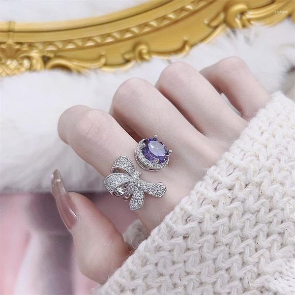 L'anello completo di zirconi viola fata dell'arco del diamante dei sacchetti dei gioielli si riferisce all'apertura femminile all'ingrosso.