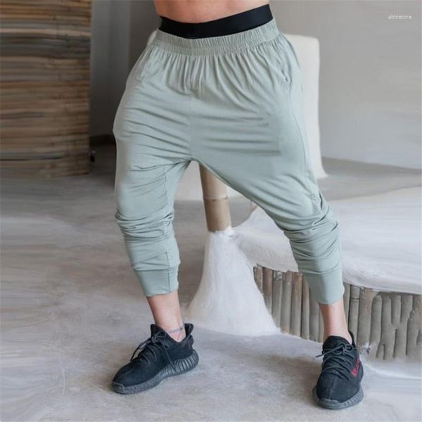 Calça masculina Homens de cor middura rápida de cor mid-cientidade de fundo respirável solto harém casual esportes finos de secagem rápida