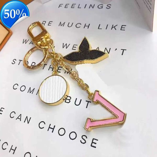 Keychains coxinúrios de designer de luxo da moda de moda de moda, marca de fivela de fivela de fivela de fivela de fivela de ouro, pingente de bolsa feminina para homens de ouro com caixas