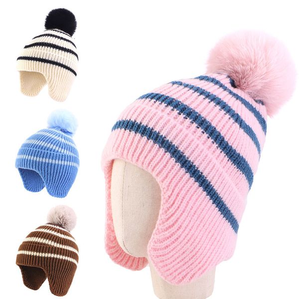 BeanieSkull Caps Stripe Winter Baby Beanie Cap Ragazzi Ragazze Inverno Caldo Lavorato a maglia Berretto di protezione per le orecchie per bambino Coreano Grande pompon Cappello all'uncinetto per bambini 230816