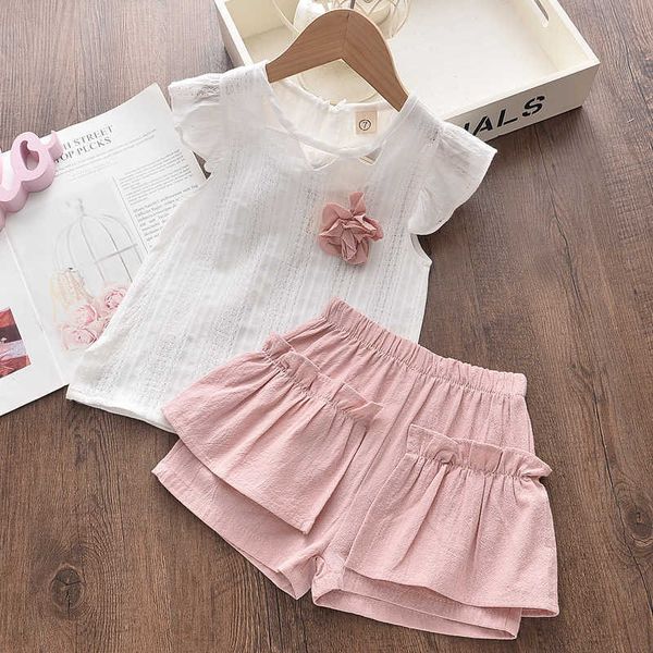 Set di abbigliamento Set di vestiti per neonate Maniche svasate estive Abbigliamento per bambini T-shirt bianca e pantaloncini per ragazza