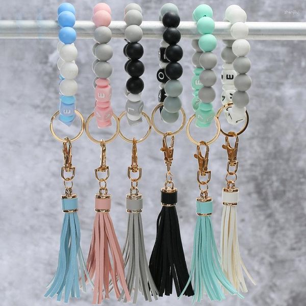 Keychains 2023 Letra de design Love Silicone Bead Pulseira Pulseira Chavening Chavela de couro Tassel Pendat Moda Anti Lost Charm Keychain Presente