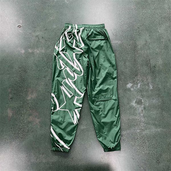 Star Ustic Megashuku Calça masculina de nylon para corrida, calça esportiva brilhante preta cinza verde com letras bordadas para corrida