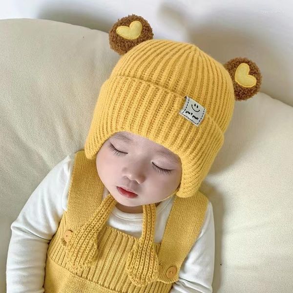 Beralar Bebek Kış Şapkası Şık Kalp Pompomları Sevimli Kalın Pamuk Astar Bonnetler Gülümseme Etiket Earsflap Gorro Kafatası Kapağı Çocuk Erkek Kızlar