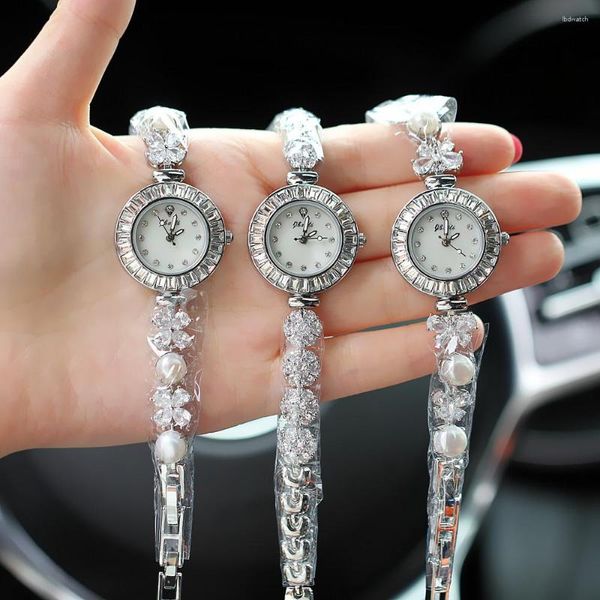 Relógios de pulso moda marca prata rosa relógio para mulheres ponteiro estilo ouro incrustado diamante dial quartzo impermeável pérola pulseira relógio de pulso