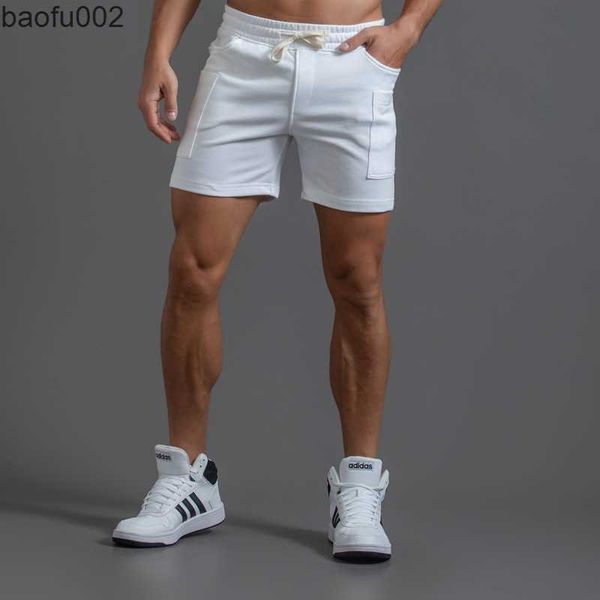 Shorts masculinos shorts brancos shorts homens treinando shorts elásticos da cintura do joelho Joggers Men Summer Workout Fitness Gym Shorts com bolso W0327