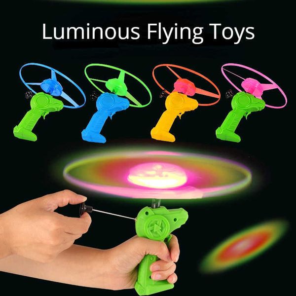 LED Çırpma Oyuncak Komik Dinozor Dönen Aydınlık Çekme Tel Uçan UFO LED IŞIK TOPLAK FLASH TOYS Çocuklar için Açık Oyun 1 PC Rastgele Renk Y2303