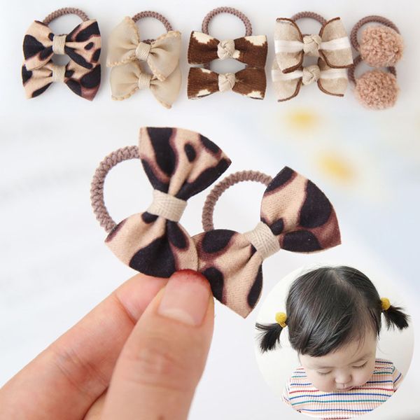 Accessori per capelli 10PcsLot Cute Leopard Bows Baby Band Fiore Reticolo Stampa Ragazze Corda Mini Pompon Elastici Bambini 230328