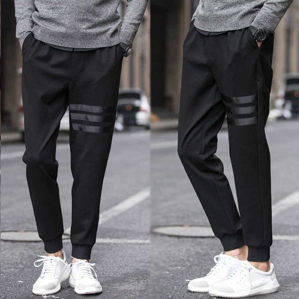 Pantaloni da uomo 2022 New Solid Casual Mens Pantaloni da jogging Pantaloni da donna Khaki Pantaloni larghi a righe BOY MAN Slim Abbigliamento da uomo maschile Streetwear M-5xl W0325