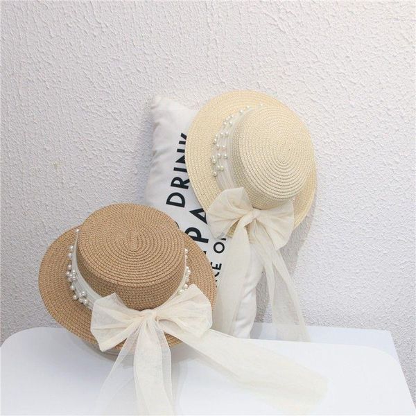 Шляпа шляпа с широкими кражами женская весна и летняя корейская версия маленькая свежая плоская топ жемчужная пряжа Боу соломенная шляпа пляжная шляпа
